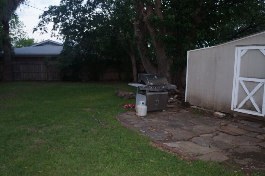 Back yard with Storage building - 5428 Topper Drive
