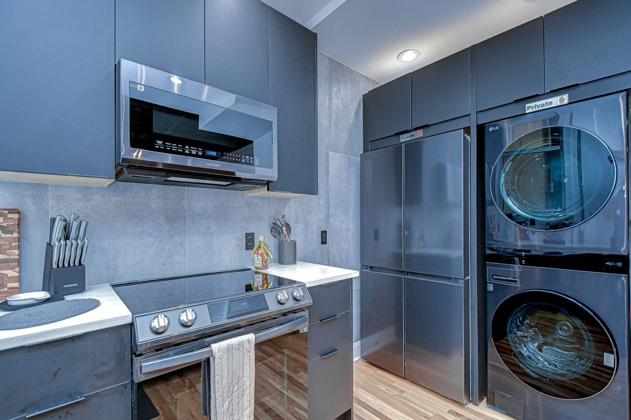Washer and dryer are located in the kitchen - 215 Central Ave