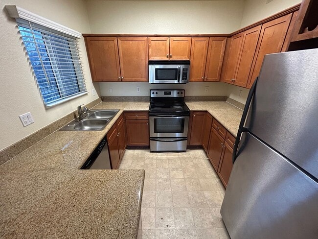 Building Photo - ADORABLE 2 BEDROOM 2 BATHROOM CONDO LOCATED IN A GATED COMMUNITY