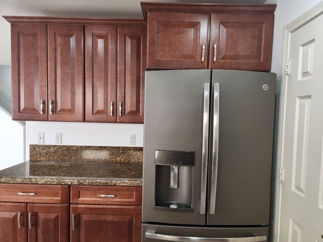 Building Photo - Sleek 2 story home with tile in most living areas and upgraded kitchen.