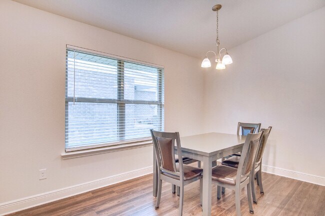 Building Photo - Spacious 4BR/2BA Brick Home with 2-Car Garage, Granite Kitchen, Vaulted Ceilings & Fully Fenced B...