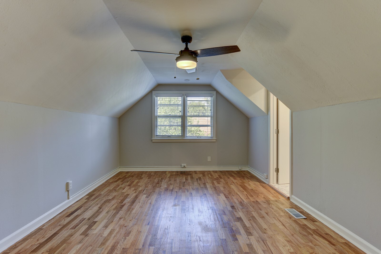 Primary bedroom with NEW ceiling fan. - 705 N 75th St