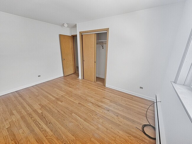 Building Photo - Mid-Century Modern 1-Bed + Den with Exposed Brick