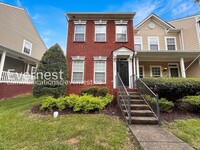 Building Photo - 2 Bed/2.5 Bath Townhome with Fenced Yard & Garage / Pet-Friendly / Available Now!
