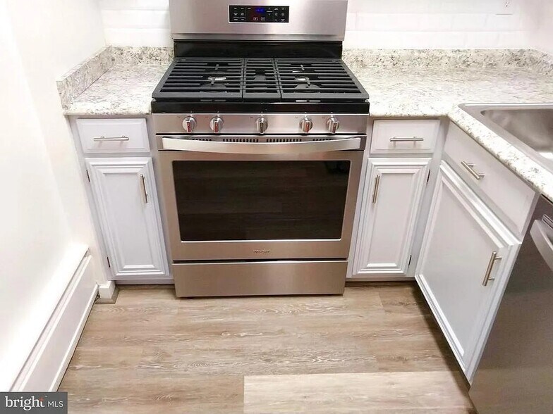 Deep cupboards and cabinets above and below. - 490 M St SW