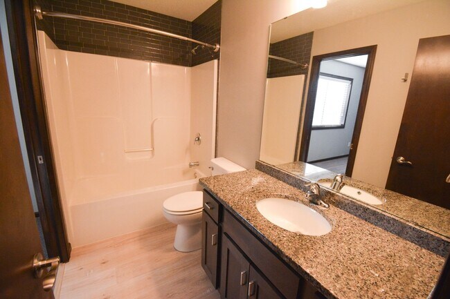 Building Photo - Remodeled 4-Bedroom Home for Rent with Garage & Deck