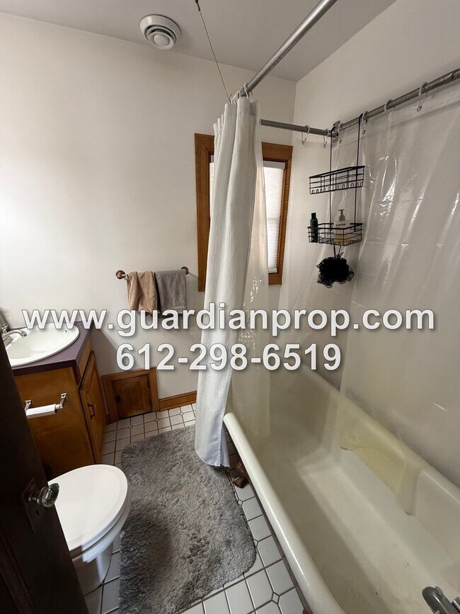 Building Photo - Merriam Park House Available May 1st, Updated Kitchen, Office, Fenced Yard, 2 Car Garage