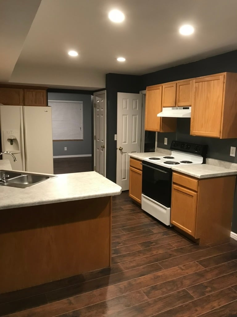 View into kitchen from dining room (all appliances have been replaced w/ stainless steel appliances) - 436 W 7th Street
