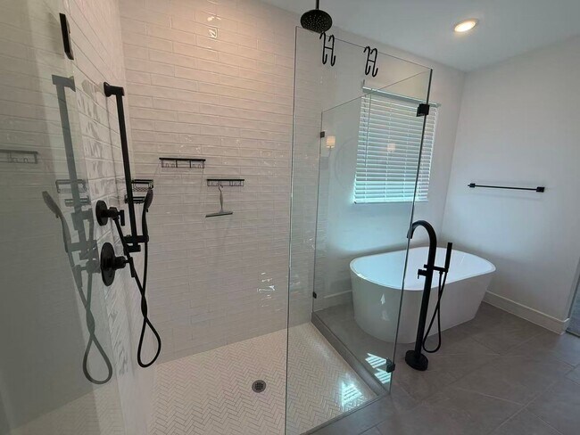 Building Photo - Move-in ready and like-new! Washer, dryer, and refrigerator Included.