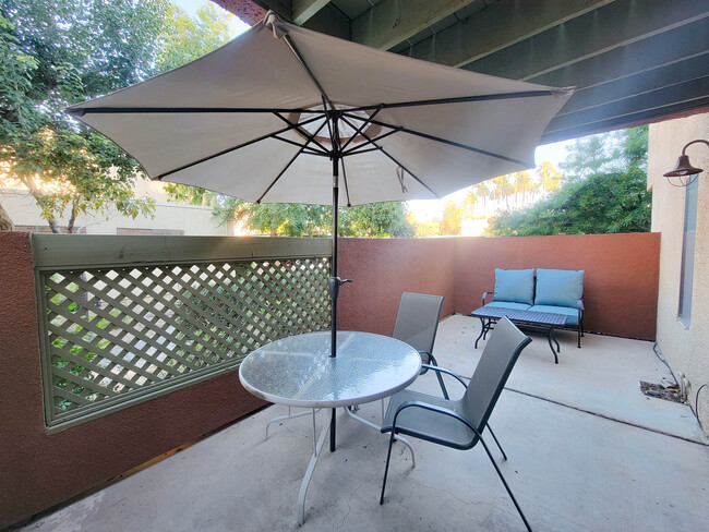 A large umbrella gives coverage from the sun so you can enjoy the oversized patio! - 3500 N Hayden Rd