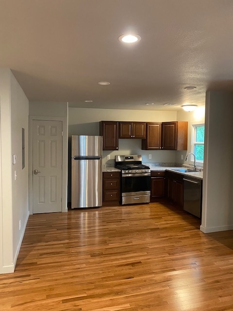 New hardwood flooring throughout kitchen & living room - 626 Vattier St