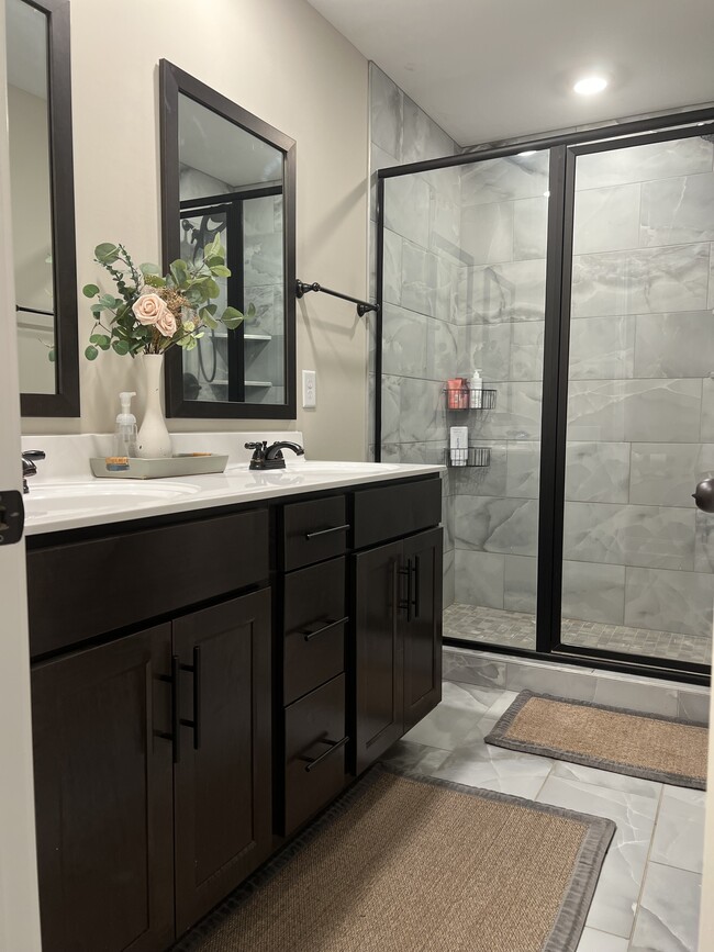 double vanity and walk in shower in the master bathroom - 2053 Jackie Lorraine Dr