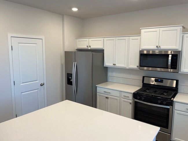 Building Photo - New Construction! Four Bedroom Home in Woo...