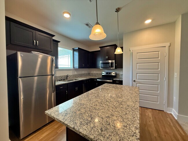 Enjoy the view of your outdoor space from the kitchen sink window. - 3010 Bellflower Cir