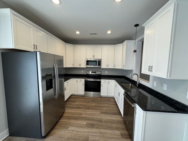 Building Photo - 1st Months Rent Free - Sunburst Villa Luxury Townhouse