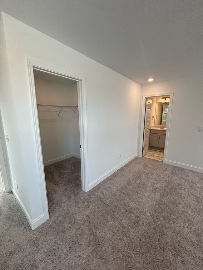 Building Photo - **BE THE LUCKY ONE TO LIVE IN THIS 2024-BUILT END-UNIT TOWNHOME IN A RESORT-STYLE COMMUNITY**