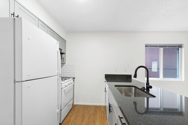 Building Photo - Immaculately Improved 2 Bedroom / 1 Bathroom Duplex & Immediately Available! - 50% Off One Full M...