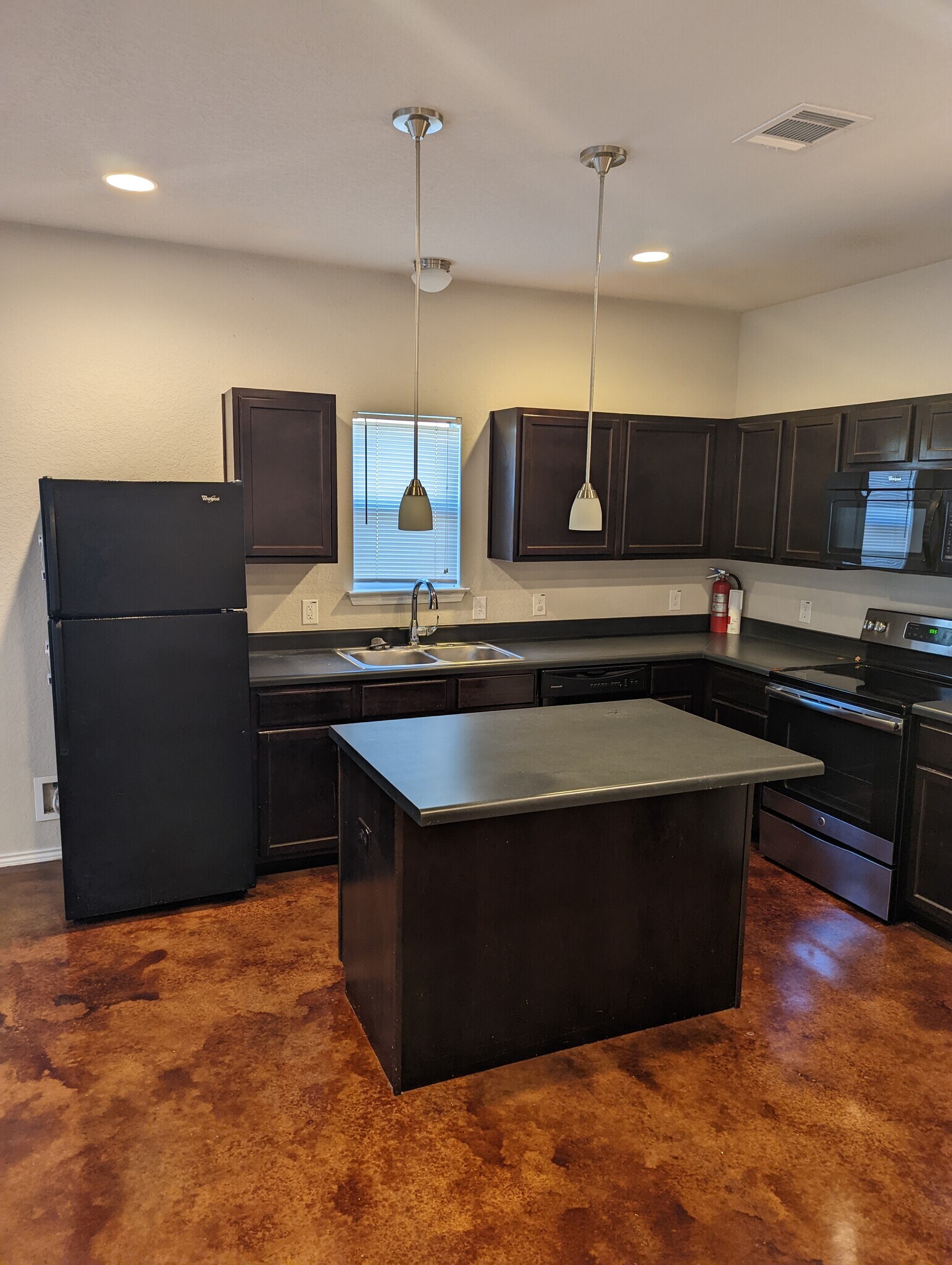Kitchen with lots of cabinets and an island - 13034 Oconnor Cv