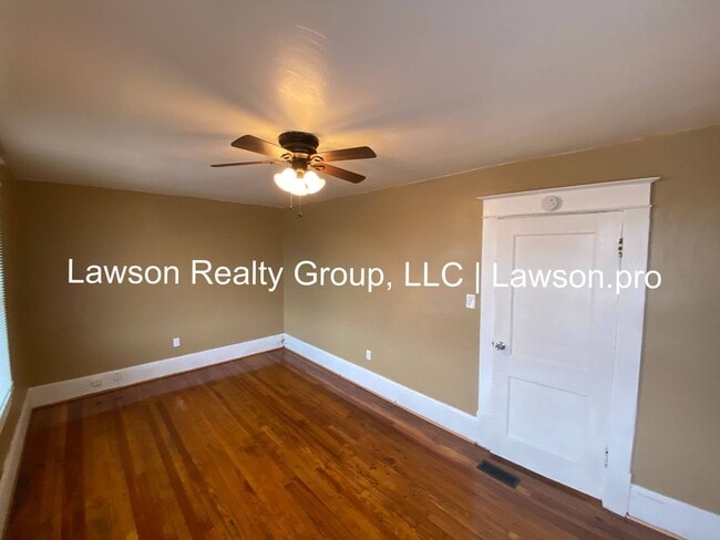 Building Photo - Updated Three Bedroom with Flat Yard