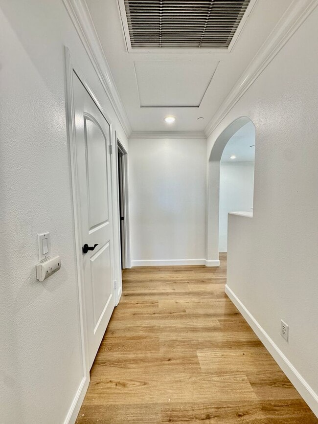 Building Photo - Beautifully Remodel Townhouse with AC & Two Car Garage!
