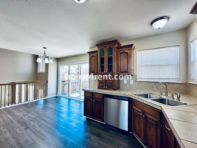 Building Photo - Spacious Four Bedroom Northland Home with a Finished Basement, 3 car garage and Fenced Yard!