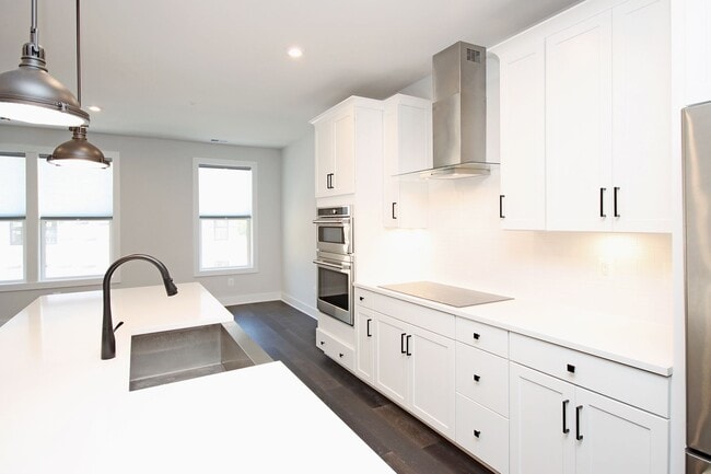 Building Photo - Spacious Brookhill Commons Townhome-Style Condo With Garage