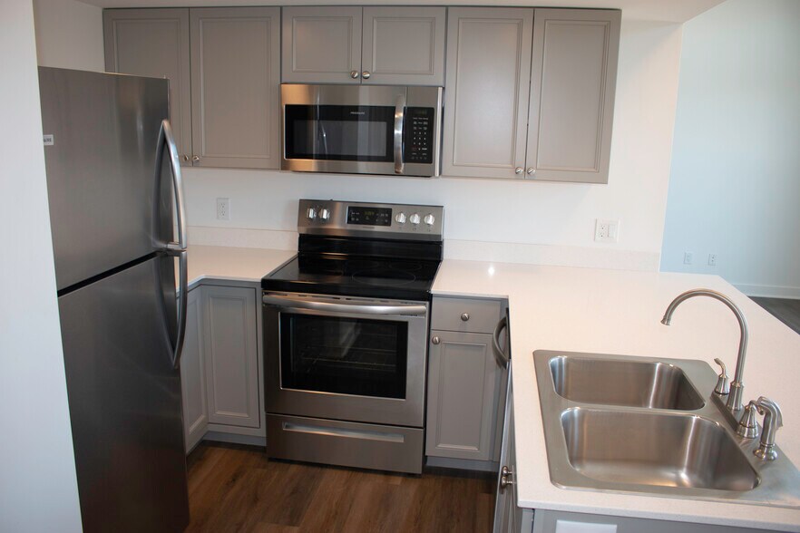 Kitchen with stainless appliances - 318 E 6th St