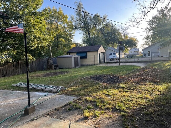 Building Photo - Clean 2 Bedroom home with hardwood flooring & large backyard