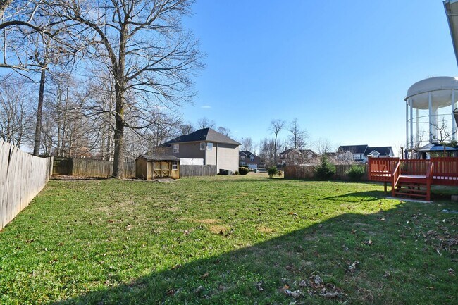 Building Photo - Pet Friendly Three Bedroom with Bonus!