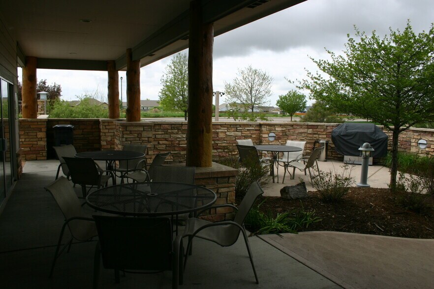 Patio area with tables grills and hot tubs - 5775 W 29th St