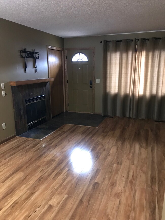 Beautiful wood laminate floor in living and dining! - 8524 S Maplebrook Circle