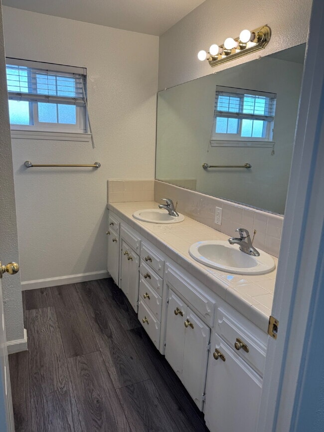 Building Photo - 4-bedroom, 2-bath home with solar, featuring a huge backyard and low-maintenance landscaping with...