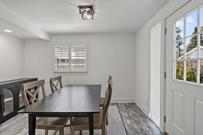 Informal dining with access to the backyard - 129 Chicago Ave N