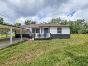 Building Photo - REMODELED 4 BEDROOM 2 BATH LEASE HOME IN A...