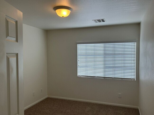 Building Photo - New flooring and freshly painted 4 bedroom home