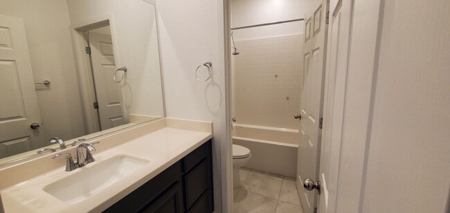 Building Photo - Beautiful townhome features a bright, open-concept layout