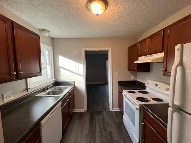 Building Photo - Beautiful Townhome with New LVP Floors and...