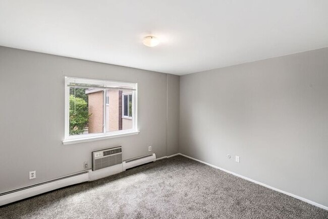 Building Photo - *Beautiful Apartment in Park Like Setting* Updated Shaker Cabinets and Appliances HEAT included