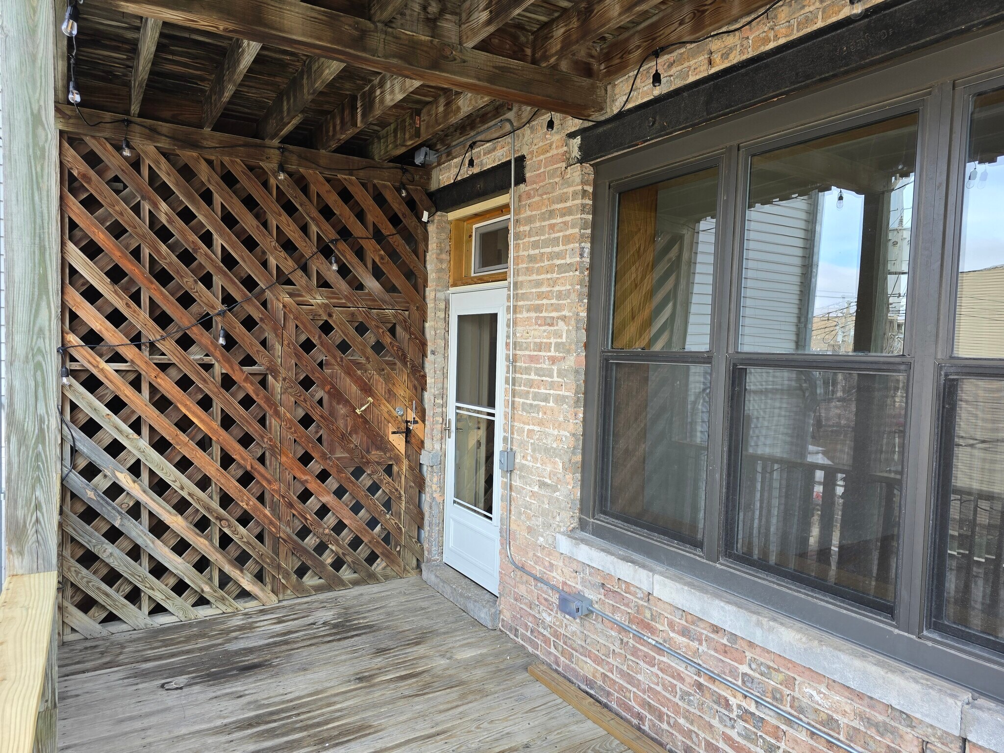Backdoor to deck with screen door - 1204 N Kedzie Ave