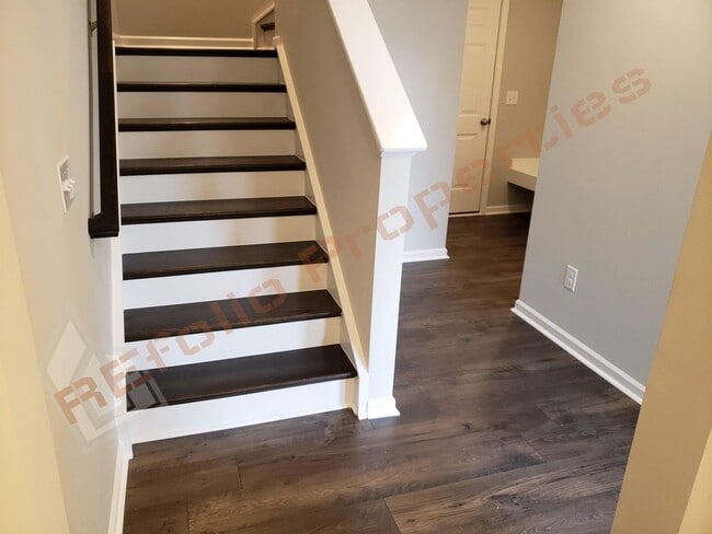 Building Photo - Beautiful Luxury 3 Story 3 Bedroom Townhome with 1st Floor Guest Suite, Attached 2 Car Garage, Co...