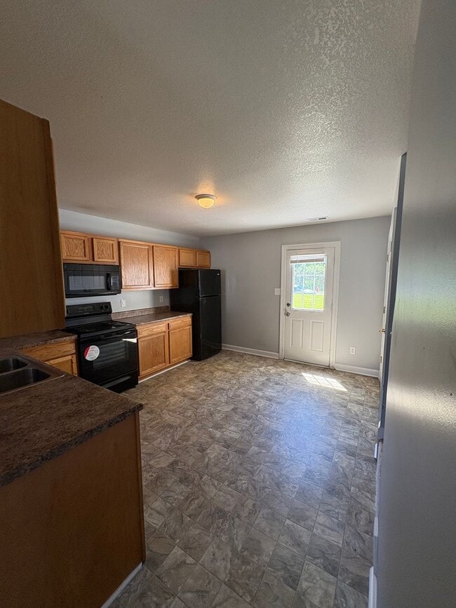 Building Photo - Charming two bedroom one and a half bath town home that is centrally located. Just a short drive ...