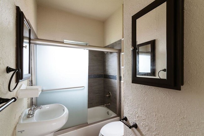 Natural light, pedestal sink and new tile in - 3811 Fox St