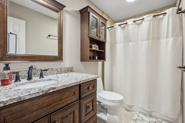 Building Photo - Modern Brick End-Unit Townhome with Stunning Upgrades and Serene Wooded Views