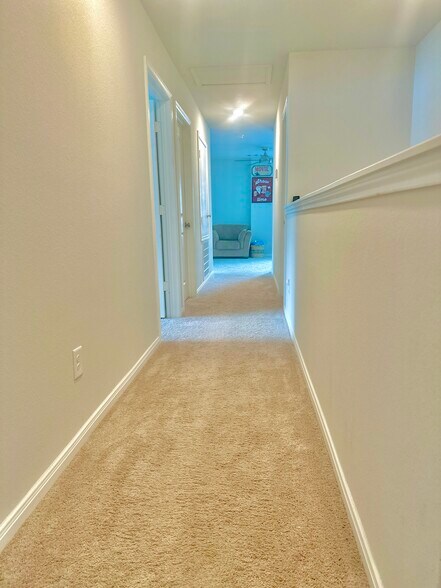 Hallway upstairs connecting to the bedrooms - 11040 Pelican Hill Ln