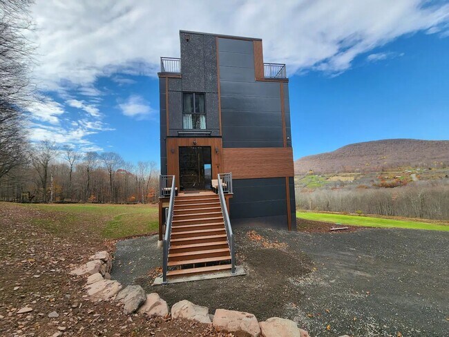 Building Photo - Modern Mountain Retreat with Rooftop Hot T...