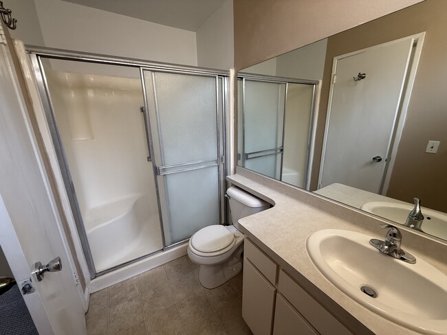 Primary bath with generous counter space and large mirror - 1134 W Huntington Dr