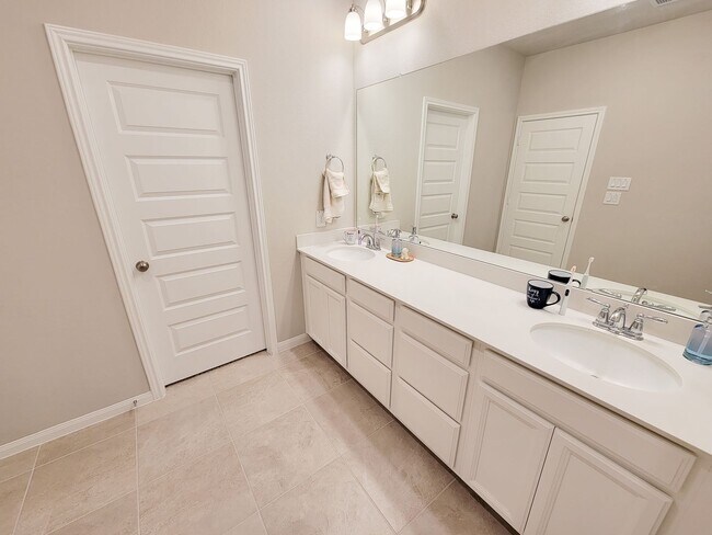 Building Photo - A true gem on a quiet corner lot, this spacious and sun-filled home is tucked away from street no...