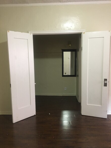 vanity area separated by doors - 545 S Hobart Blvd