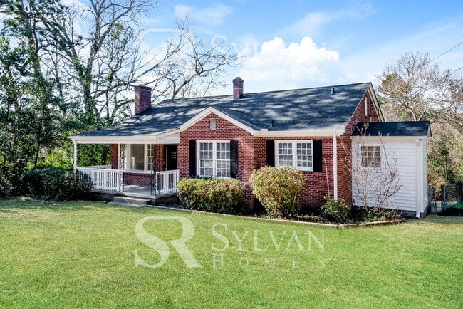 Building Photo - The living is easy in this 3 bedroom, 2 bathroom brick home