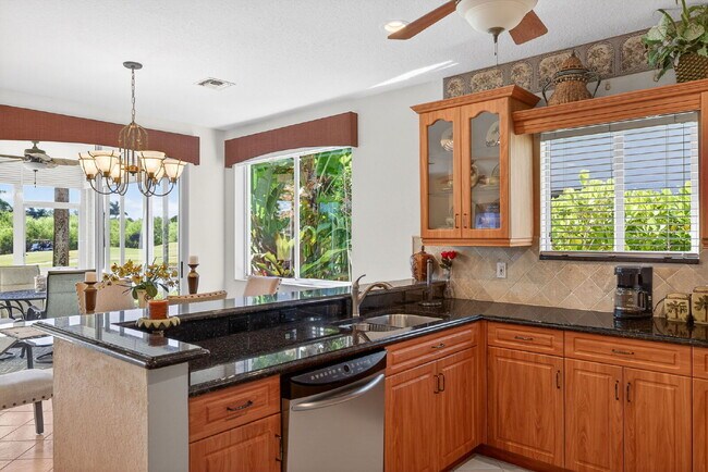 Building Photo - This 2 bedroom plus den, 2 bath condo with a one car garage offers expansive golf course and lake...